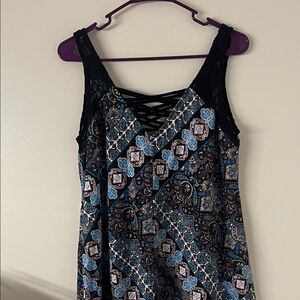 Boho style patterned lace trimmed sleeveless top.